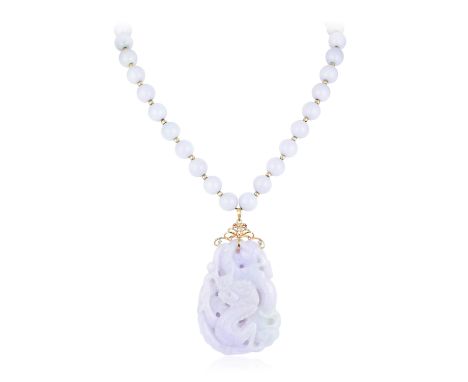 The jade pendant carved with a dragon on the front and a phoenix on the back, set with a 14K yellow gold bail, accented with 