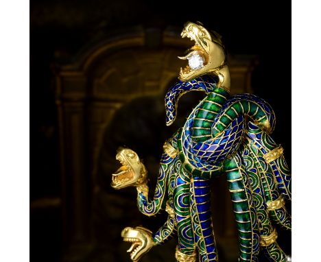 A striking brooch, featuring nine snakes in a knot, beautifully crafted out of 18K yellow gold, with blue and green enamel, f