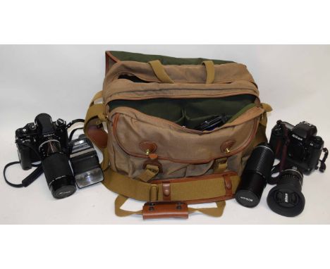 Nikon F3 camera with telephoto lens, Nikon F5 camera, various other lenses, accessories etc all contained in camera bag