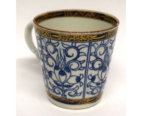 18th century Worcester coffee cup with shaped handle, decorated in underglaze blue with the Royal Lily pattern.