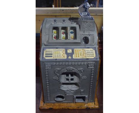 Vintage fruit machine labelled for Mills, 38cm wide