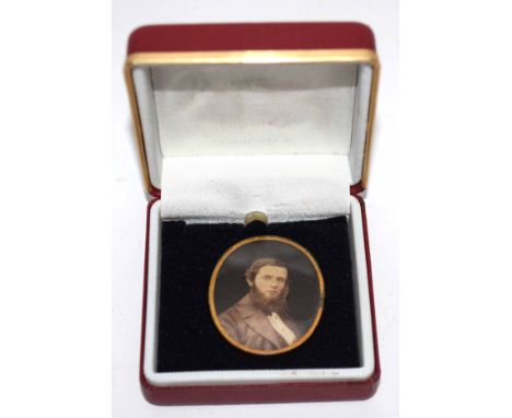 Vintage oval pendant inset with a print depicting a head and shoulders of a gentleman   