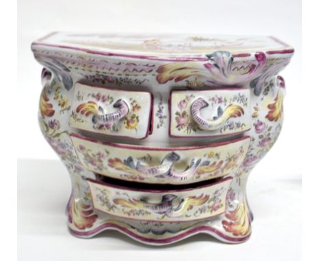 Continental pottery jewellery box, the top decorated with a couple in a landscape scene, the individual drawers with floral d