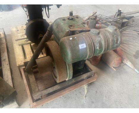 A Wolseley petrol paraffin 1.5HP stationary engine on four wheel skate. 