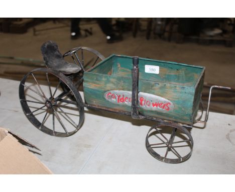 A vintage metalwork model of a tractor 