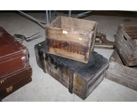A wooden tool chest and a wooden crate named to Tolly-Cobbold