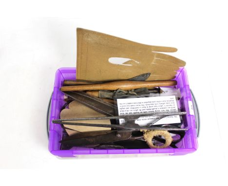 A box of glove makers tools including stretchers, scissors, stencil etc.