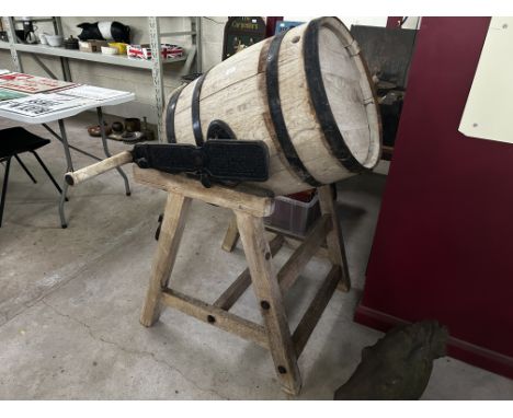 A vintage butter churn on stand
