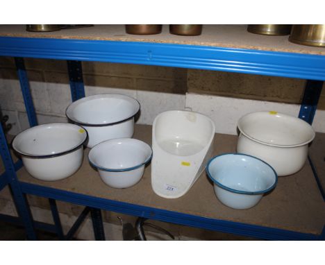 Four enamel bed pans and two ceramic bed pans