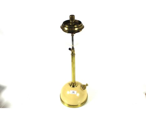 A long stem Tilley table lamp with cream base 
