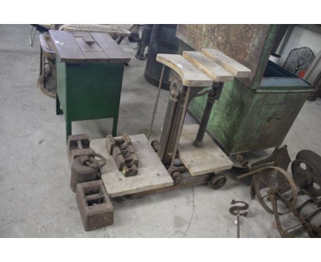 A set of W &amp; T Avery Ltd sack weighing scales, two 56lb weights, a cylindrical weight with ring handle and four others