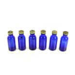 A set of six Salvitae American Apothecaries of New York blue glass bottles