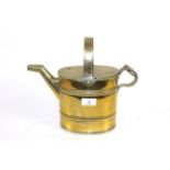 A small brass watering can