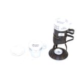 A Clarkes ceramic very early vintage food warmer with a separate spare food warmer