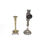 A students nickel plated candle lamp and a brass candle holder