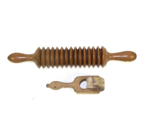 A 19th Century Welsh sycamore crushing roller and a sycamore butter marking wheel with leaves and acorns
