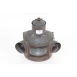 An unusual copper hanging or fixed paraffin operated lamp with red and green glass indicators to the