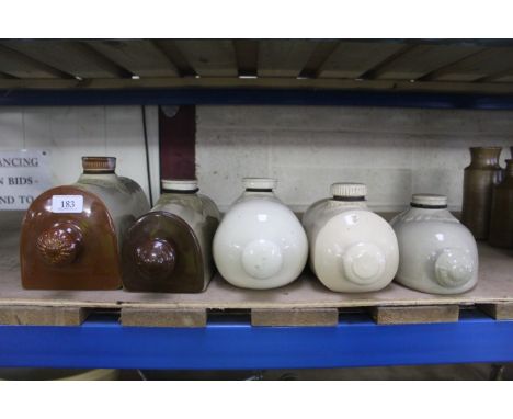 Five various size ceramic hot water bottles / bed warmers