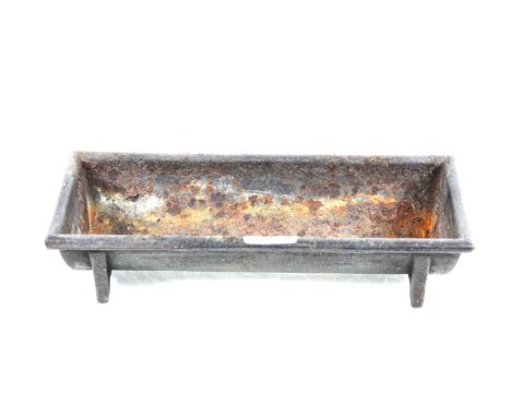A small cast iron trough, approx. 12½" x 5"