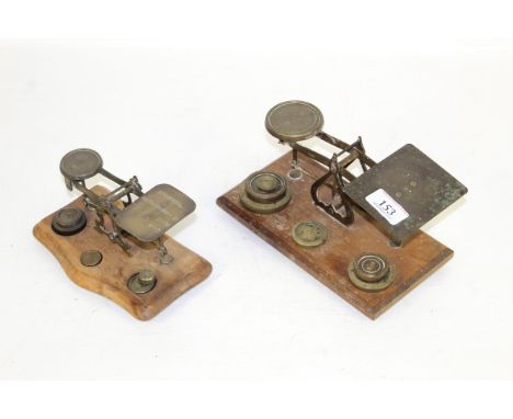 Two sets of letter postage scales with some brass weights