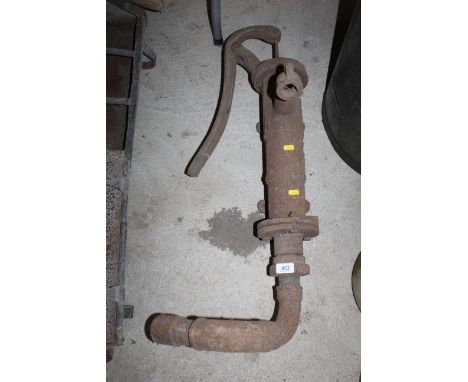 A vintage cast iron hand operated water pump