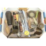 A tray of miscellaneous kitchen tools