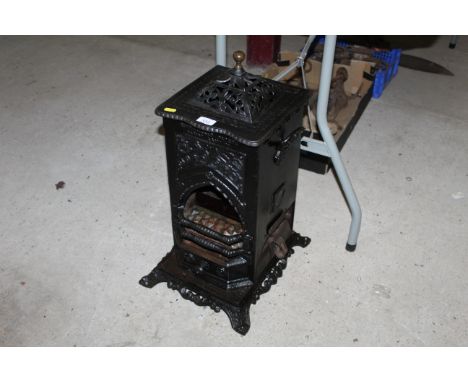 A cast iron / steel Rippingilles patent Albion Lamp Co. oil stove with burner