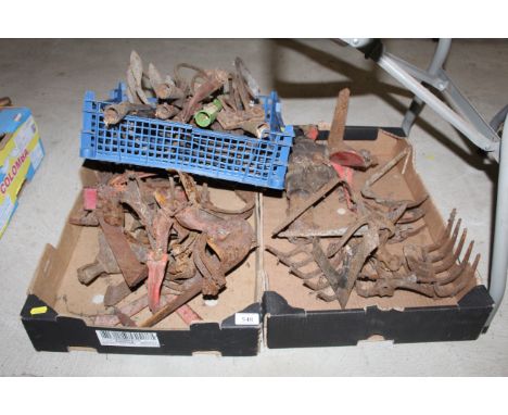 A quantity of various vintage tool head attachments to include rake, tine cultivators, hoe blades, etc.