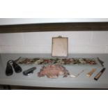 A quantity of various bygones to include a pair of Lancashire leather child's clogs, fans, a stone