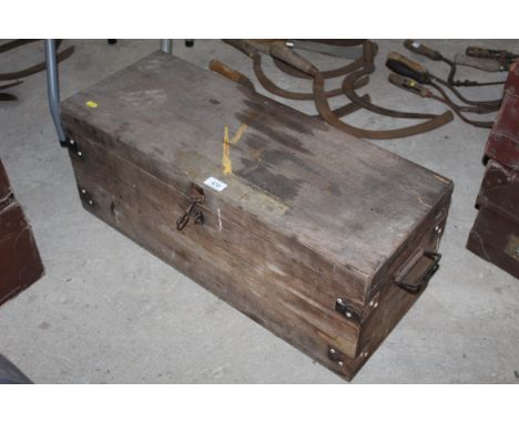 A wooden and metal bound tool chest with twin handles