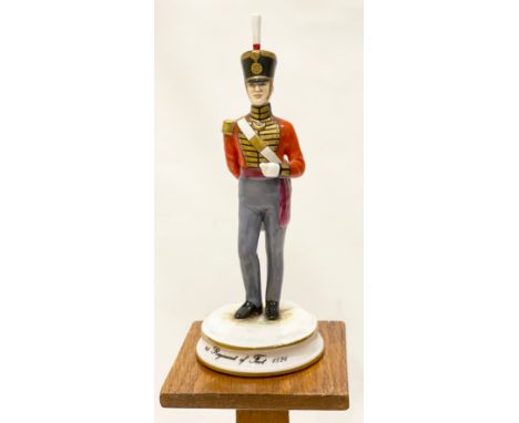 1st Regiment of Foot 1826 China Porcelain Figure by Michael Sutty.This good study of an Officer wearing scarlet coatee and sh