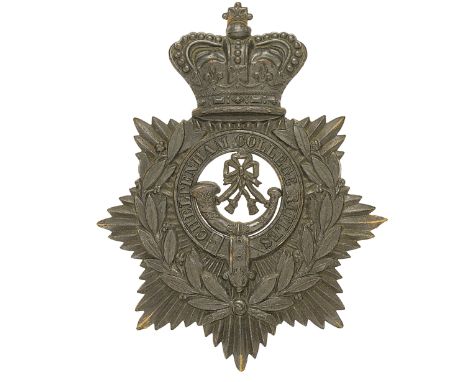 Cheltenham College Rifles Victorian helmet plate circa 1883-89.A fine and scarce die-stamped blackened brass example worn on 