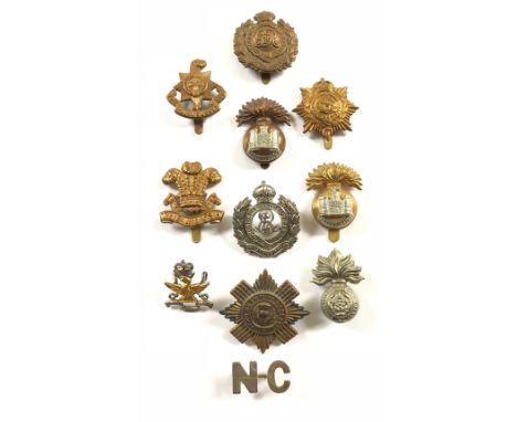 11 assorted badges.1916 brass economy Royal Sussex, Royal Engineers, Army Service Corps and Welsh ... Inniskilling Fusiliers 