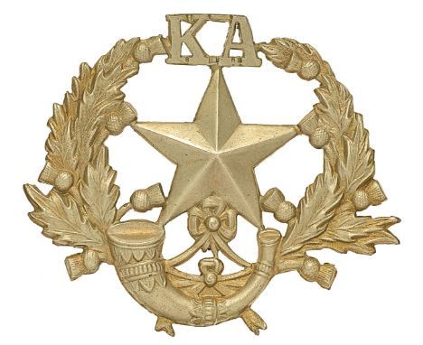 Scottish. Kelvinside Academy OTC white metal glengarry badge.A scarce die-stamped example of Cameronians pattern. Mullet over