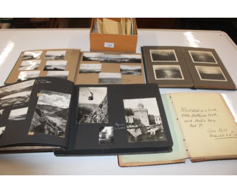 Three albums containing black and white photographs, a  sketch album with various signatures and a box of loose stamps 