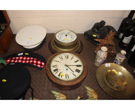 A brass cased ships style barometer and a circular cased wall clock 