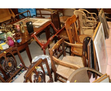 A spindle rush seated elbow chair; a stick back chair; and a cane seated bedroom chair 