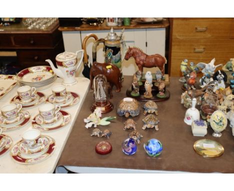 A collection of Wade tortoises; glass paperweights; carved wooden elephants; a beer Stein; Royal Doulton model owls etc. 