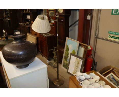 A brass adjustable standard lamp