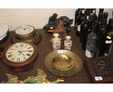 A carved hardwood model of figure seated on a buffalo; a root carving; two Oriental vases; and two brass dishes 