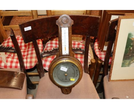 An oak cased barometer / thermometer 