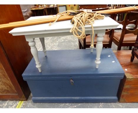 A GREY PAINTED COFFEE TABLE TOGETHER WITH A BLUE PAINTED WOODEN TRUNK AND A LAUNDRY MAID.