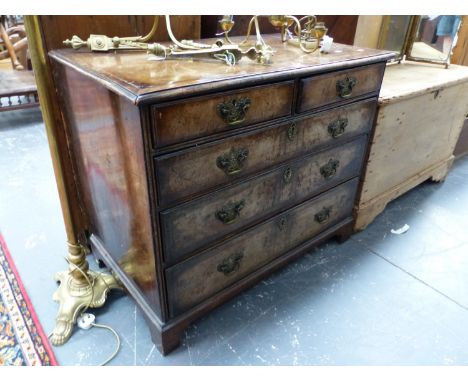 AN 18th C. WALNUT CHEST OF TWO SHORT AND THREE GRADED LONG DRAWERS ON BRACKET FEET