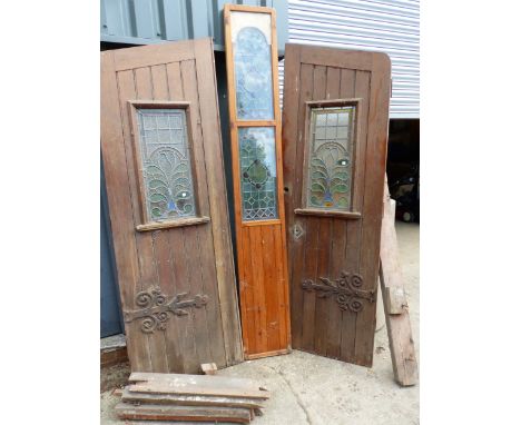 A PAIR OF PITCH PINE DOORS WITH CENTRE PANEL AND FRAME, ALL WITH LEADED GLASS WINDOWS ( FOR RESTORATION)