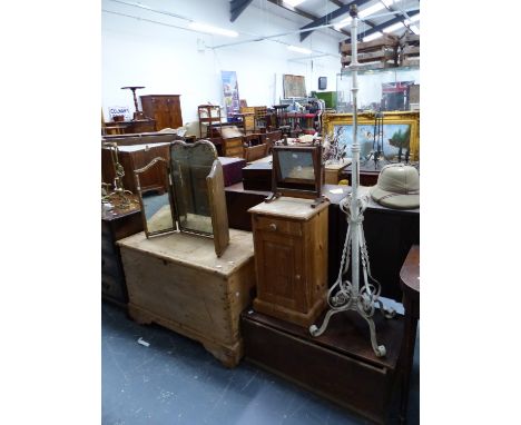 A PINE COFFER, A BEDSIDE CUPBOARD, AN OAK COFFER, TWO DRESSING TABLE MIRRORS AND A WROUGHT IRON STANDARD LAMP