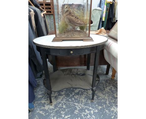AN OVAL WHITE MARBLE TOPPED EBONISED TWO TIER TABLE WITH SINGLE DRAWER