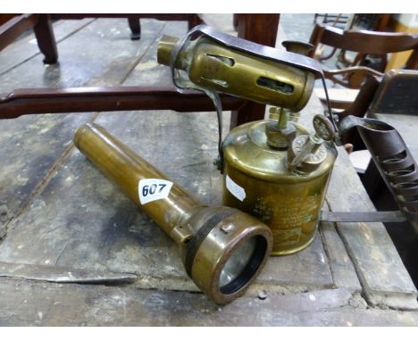 A VINTAGE DIVERS OR MINERS TORCH AND A BLOW LAMP