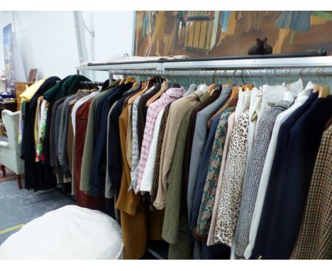 A LARGE COLLECTION OF VINTAGE AND MODERN LADIES AND GENTS CLOTHING TO INCLUDE BURBERRYS, AQUASCUTEN, ESCADA, VARIOUS TWEED, J