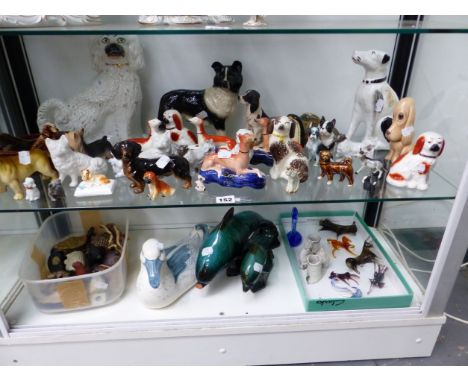 A COLLECTION OF CERAMIC DOGS AND OTHER FIGURES