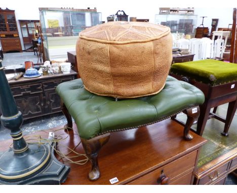 A BUTTONED GREEN LEATHER FOOTSTOOL, A BROWN LEATHER POUFFE AND A GREEN PAINTED TURNED WOOD STANDARD LAMP